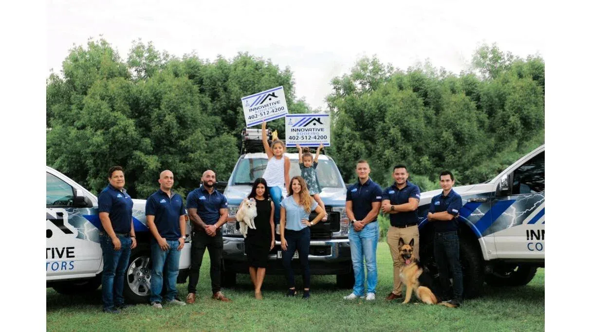 The Innovative Roofing team with their trucks and families in the Midwest
